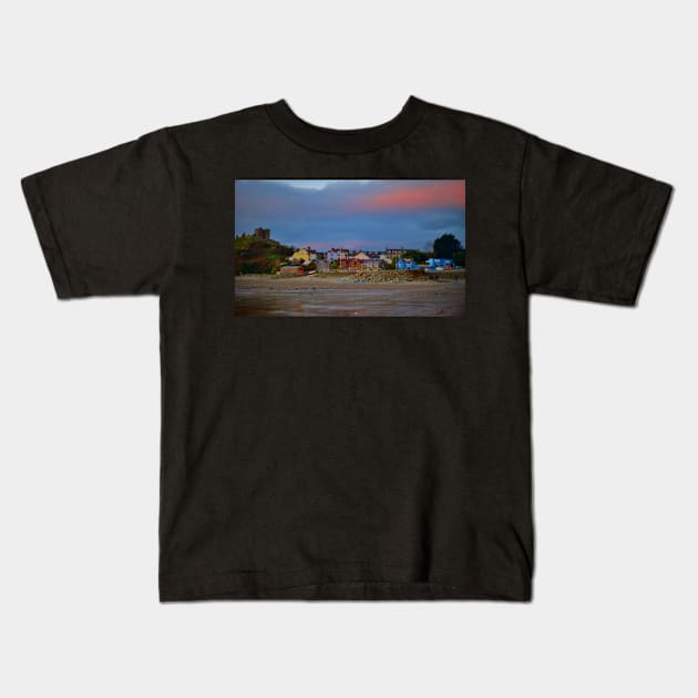 WINTER FIRST LIGHT OVER CRICCIETH Kids T-Shirt by dumbodancer